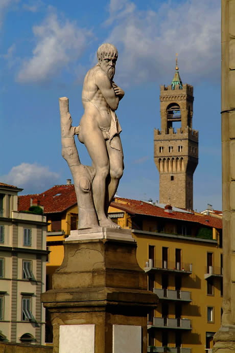 The statue inverno on the bridge ponte di santa trinita in Florence photo