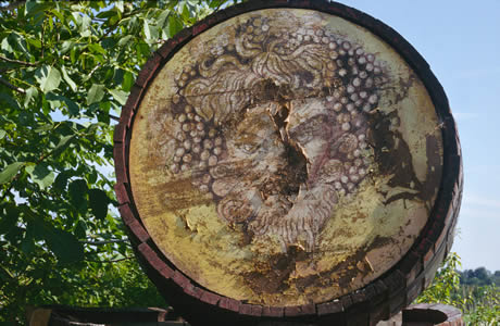 Tuscan wine barrel and bacchus photo